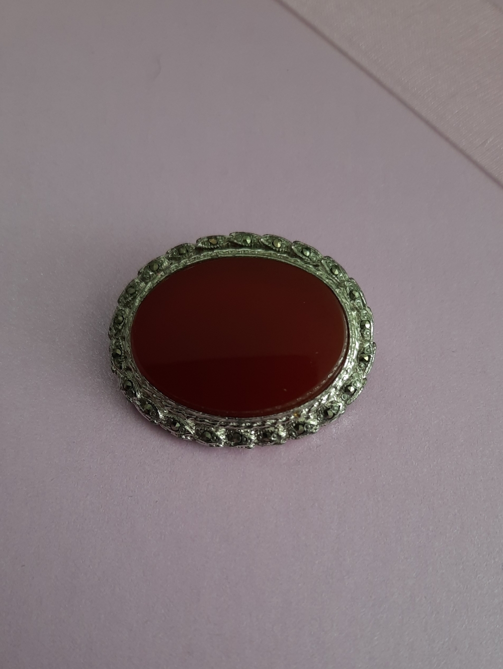 Vintage-Inspired Red Oval Brooch with Silver-Tone Frame